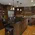 maple-cabinetry-stained-wenge-absolute-black-granite-slate-and-metal-mixed-backsplash