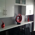 maple-cabinets-painted-white-with-high-gloss-finish-frosted-glass-door-decorative-inserts